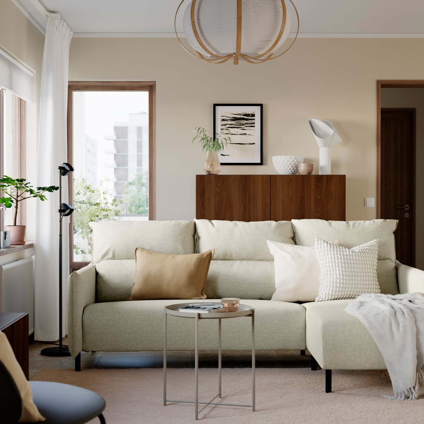 A Gunnared beige MANNARP 3-seat sofa with chaise longue in the living room