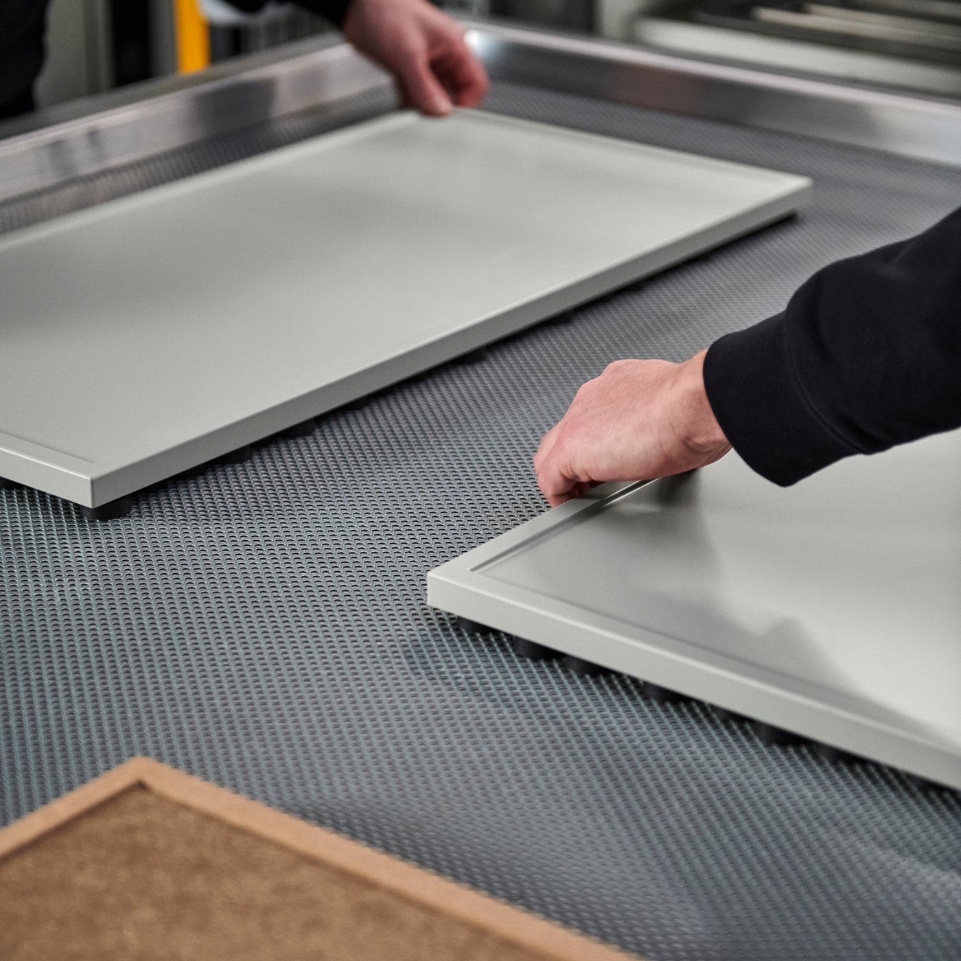 ASPUDDEN kitchen cabinet fronts being manufactured.